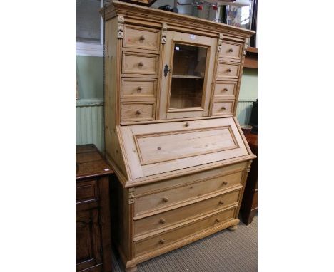 A multi drawer top with central cupboard over fall down front and three full width drawers, 173cm x 113cm&nbsp;