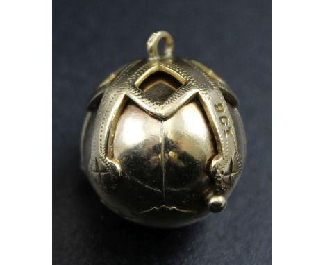 A 9ct gold Masonic orb pendant, opens to reveal six silver gilt pyramids, engraved with symbols, gross weight 12g&nbsp;