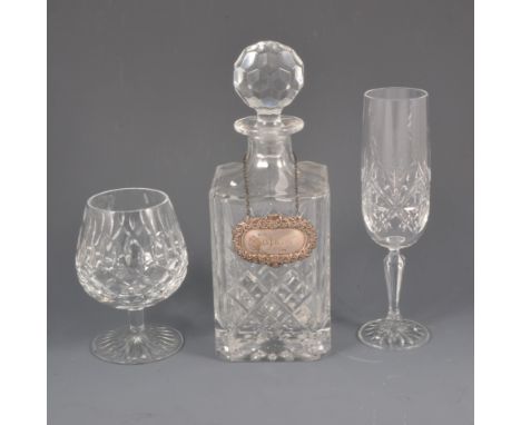 A lead crystal decanter with silver whisky label, four Stuart brandy balloons, drinking glasses and bowls.
