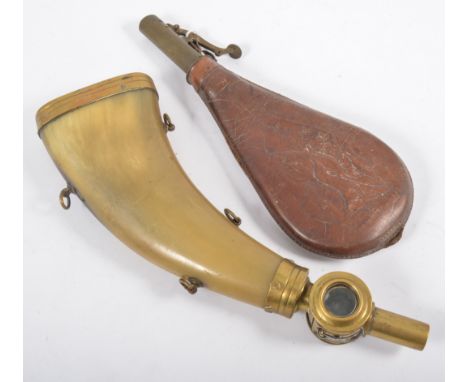 A French 19th Century flattened horn shotgun flask, with brass mounts and glass measure windows, by Boche Paris, and a leathe