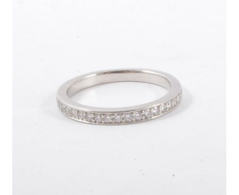 A Hearts on Fire diamond eternity ring, twenty brilliant cut diamonds pip claw and line edge set in a platinum half eternity 