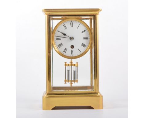 Brass cased "four glass " mantel clock, circular dial French cylinder movement mercury pendulum, 26cm.
