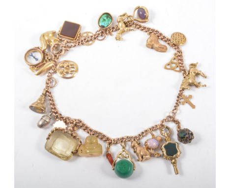 A substantial gold charm bracelet, a 9 carat rose gold two row solid graduated curb link bracelet (originally a watch albert)