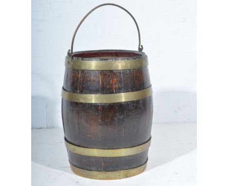 Coopered oak barrel, now a circular stick stand, 42cm; and brass stair rods.