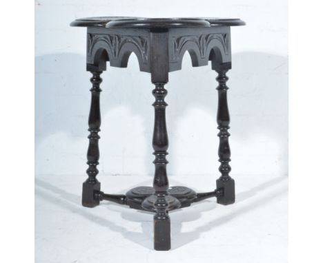 Victorian oak occasional table, triform top, turned legs joined by a shelf, height 65cm.