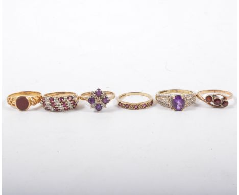 Six gemset dress rings, five 9 carat yellow and white gold rings set with amethyst, ruby, garnet, diamonds and synthetic whit