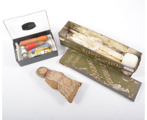 A small number of sewing requisites, two enamel and two other cotton holders, a cloth dolly pin cushions, bone cotton holder 