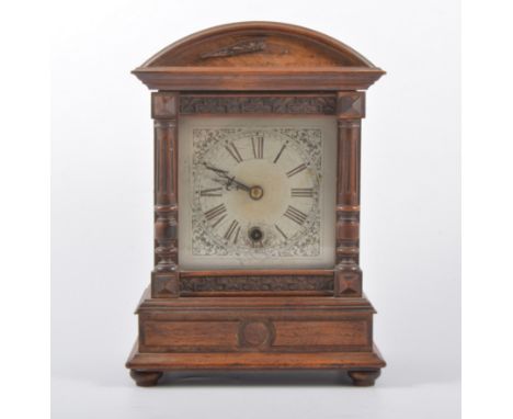 A German walnut cased mantel clock, silvered dial, spring driven eight day movement, 98cm.