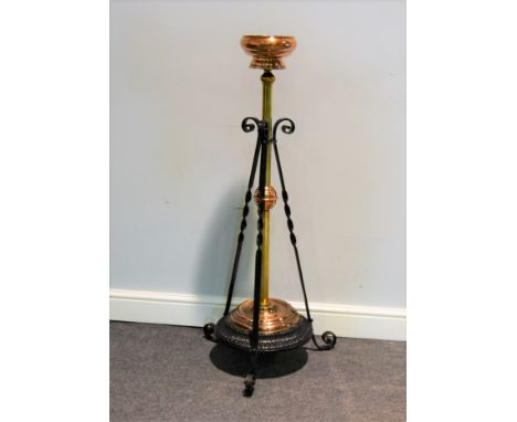 Wrought iron brass and copper adjustable jardiniere stand, adapted from a lamp base height, 111cm.