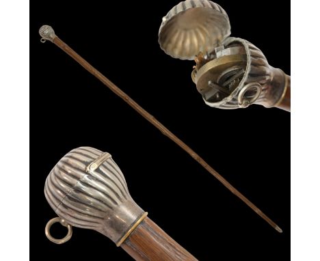 A Rare Walking Stick, cane with lighter, late 19th - early 20th century. Wooden shaft with silver pommel with lighter. RTF le