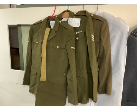 3 Replica Army outfits together with a military issue great coat.