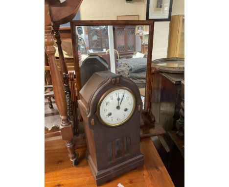 A small mahogany dressing mirror together with a 1930s mantle clock.