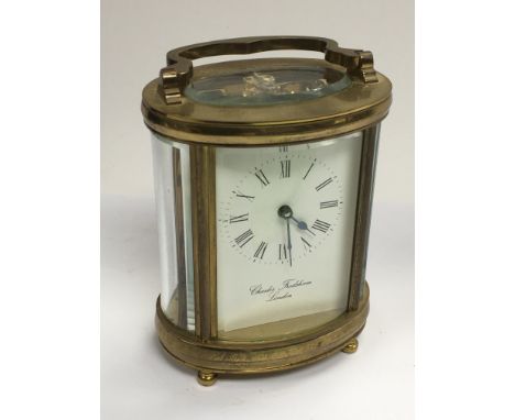 A brass cased carriage clock by Charles Frodsham of London.
