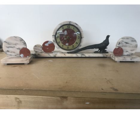 Art Deco clock set, circular dial with Arabic numerals flanked with a pheasant, with side ornaments. Approx 75.5cm wide inclu