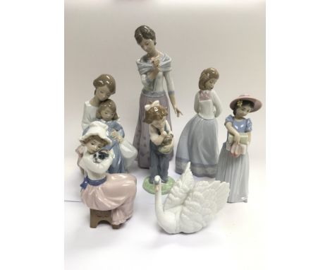 Four Lladro and three Nao figures of children and animals. Some boxed with certificates.