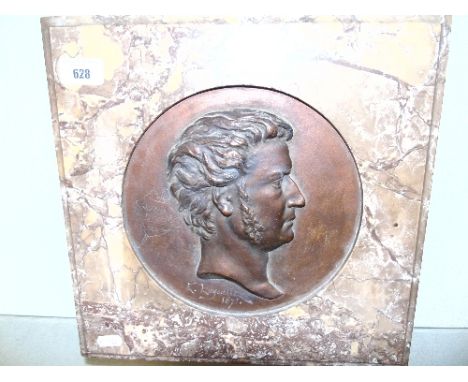 A French Plaster Relief signed E Laysalle, 1871 in the form of a bronze portrait plaque in a marble surround, impressed to ba