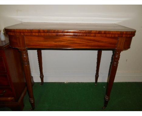 An Early 19th Century Mahogany Card Table with crossbanded top