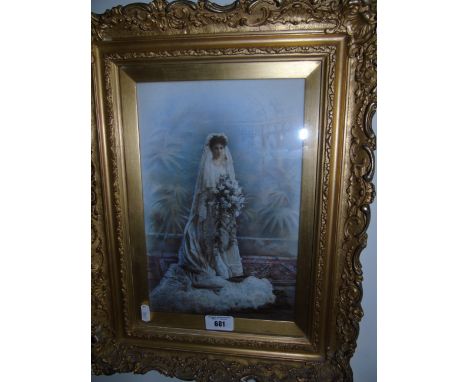An Early 20th Century Oleograph of a Bride in a decorative gilt frame. 29 x19.5cm.