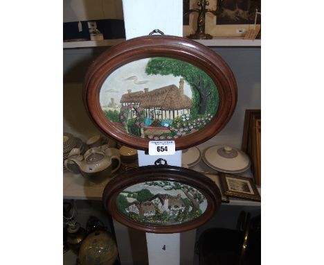 Two Ceramic Wall Hangings depicting Cottages, 44.5 x 60cm.
