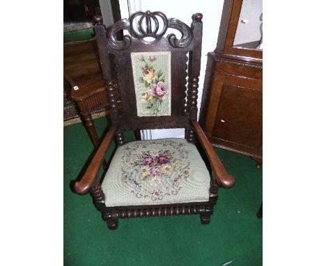 A Late 19th Century Oak High Back Hall Chair with bobbin turnings, having a tapestry upholstered seat and back. 