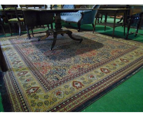 A Cream Ground Woollen Carpet with floral decoration, 128" x 107".