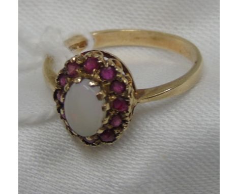 A 9 Carat Ruby and Opal Cluster Ring.