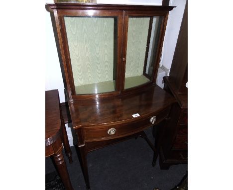 An Edwardian Bow Fronted Display Cabinet, the glazed top having a single glass shelf, above single drawer with inlaid design,