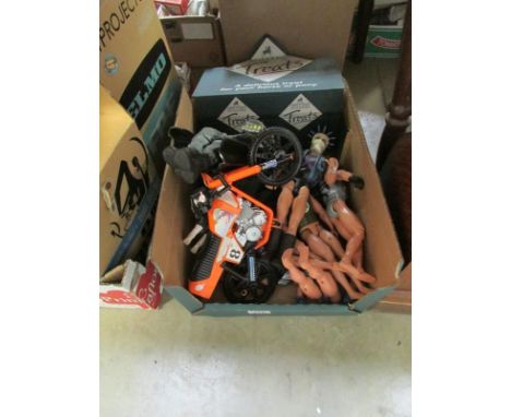 A box of action man type figures