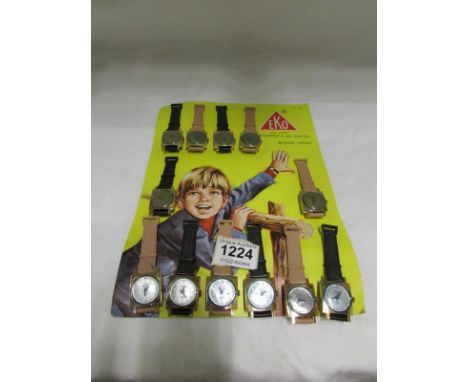 A card of vintage toy wristwatches