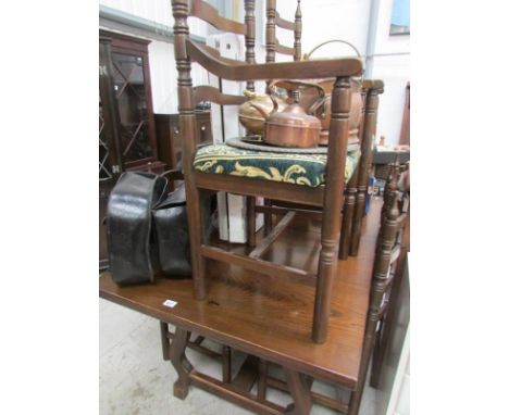 A good oak dining table and 6 Gothic style ladder back chairs
