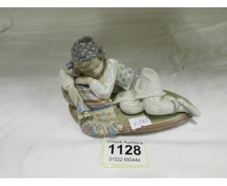 A Lladro girl on cushion
Condition
No damage