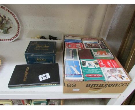 34 souvenier playing cards, chess pieces, pocket games etc