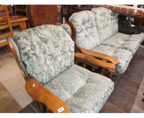 An oak framed sofa and rocking chair