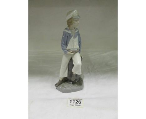 A Lladro boy with model yacht
Condition
No damage