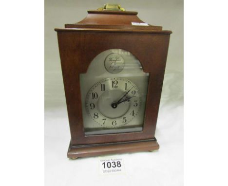 A mahogany bracket clock with silvered dial