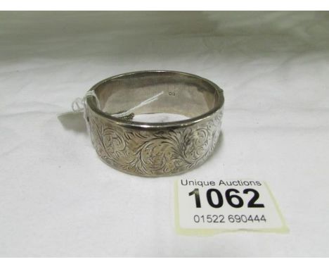 A silver bangle (50 gms)