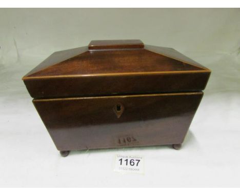 A Victorian mahogany crossbanded tea caddy (missing inner lid knobs but otherwise in good condition)