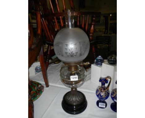 A Victorian oil lamp on pot base with glass font and acid etched shade