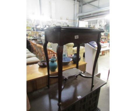 A mahogany fold over card table