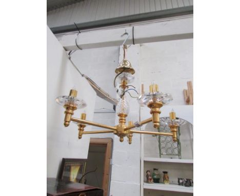 A 6 light gilded and glass chandelier