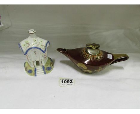 A Carlton rouge royal Aladdin lamp lighter and a Coalport cottage