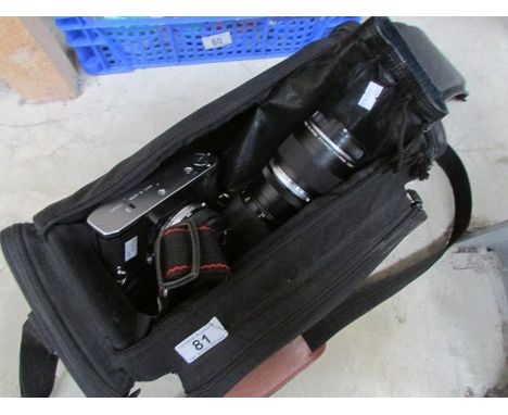 An Olympus OM20 camera with accessories