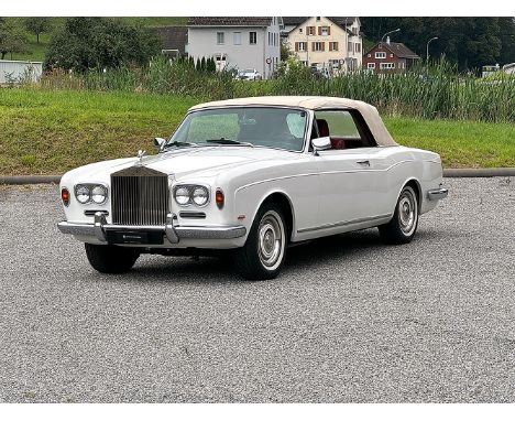 The 1969 Rolls-Royce Silver Shadow DHC is a rare five-seater luxury vehicle, with only 505 units produced. Finished in a whit