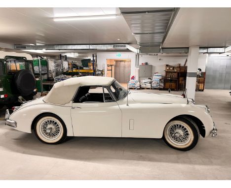 The 1959 Jaguar XK 150 DHC is a classic sports car known for its elegant design and historical significance. This particular 