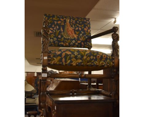 A carved oak and beech armchair in 17th century style, 20th century, with tapestry upholstery 