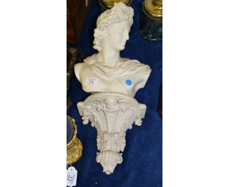 A biscuit porcelain bust after the Apollo Belvedere, late 19th century, 26.5cm high; and a Parianware porcelain wall bracket,