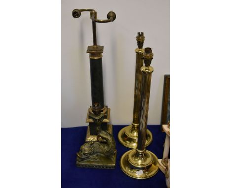 A pair gilt metal table lamps; a Louis Philippe style lamp and a composition dolphin lamp base, all late 20th centuryThis lot