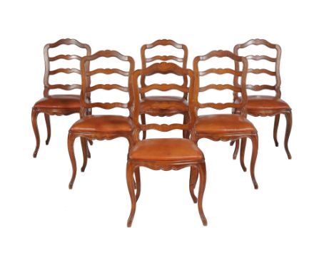A set of six Continental walnut ladder back dining chairs with drop in seats 