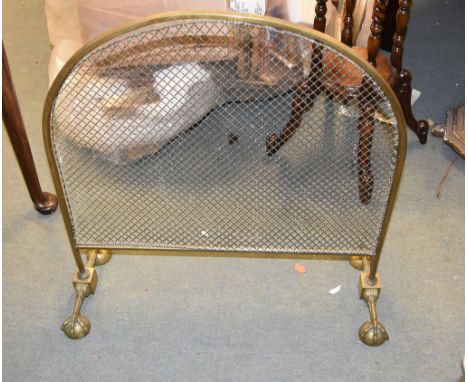 A brass and wire mesh arch topped firescreen in early 19th century style, circa 1900, 68cm high 
