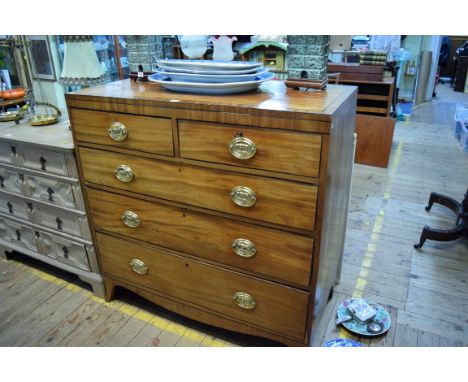 Of local interest: a late George III mahogany, line inlaid and crossbanded chest of drawers, of two short and three long grad